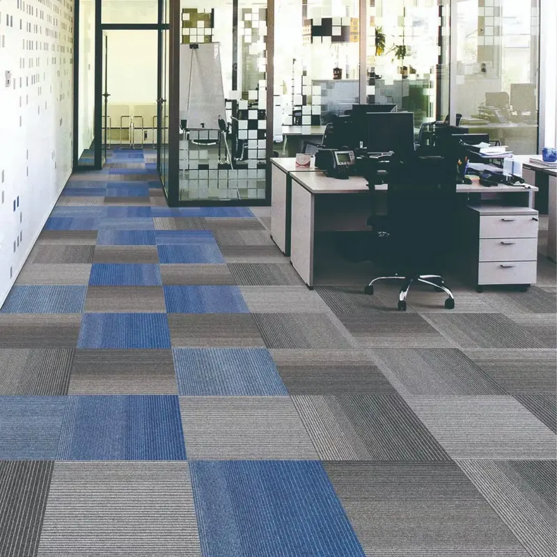 Blue and grey carpet tiles in an office corridor.