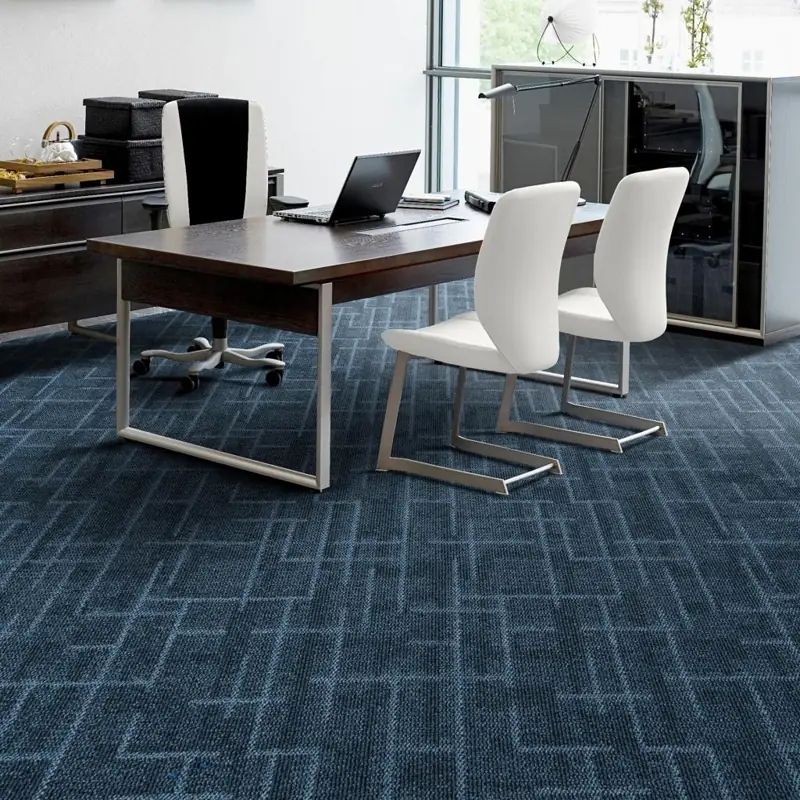 Blue geometric grid carpet tiles in modern executive office