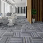 Bright open office featuring grey striped carpet tiles