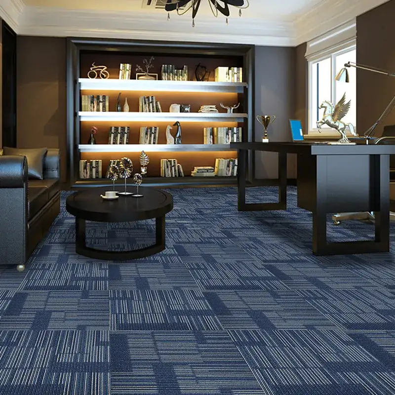 Dark blue geometric patterned carpet tiles in executive office