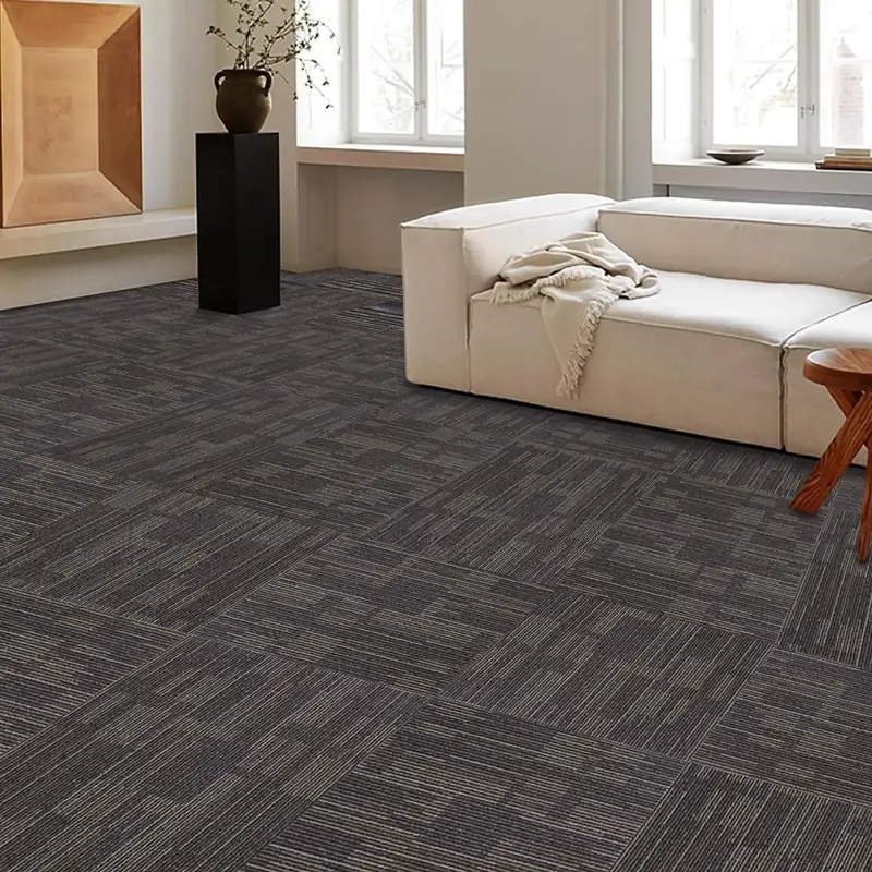 Dark charcoal striped carpet tiles in modern lounge setting