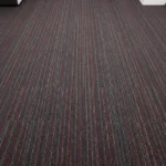 Dark gray and red striped ribbed office carpet tiles installed in a commercial space.