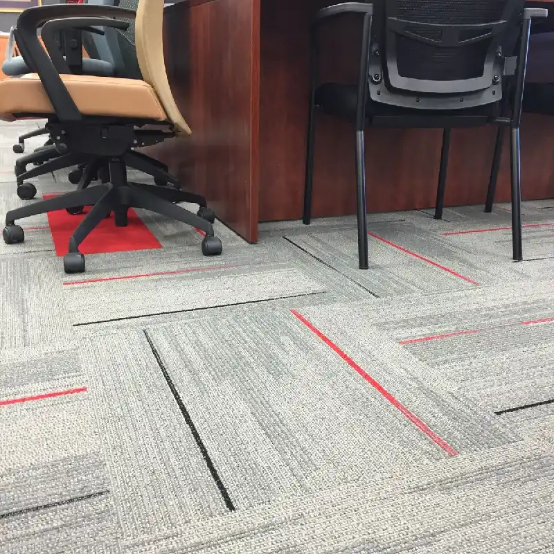 Gray carpet tile with red and black accent lines