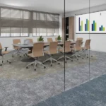 Gray carpet tiles featuring blue and beige accents in a glass conference room