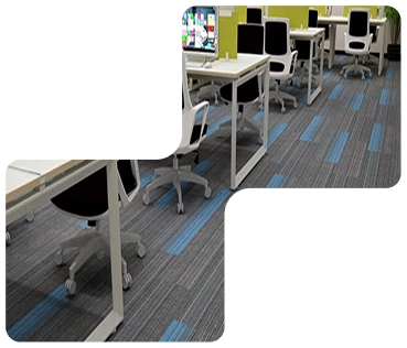 Grey and blue patterned carpet tiles in a modern office