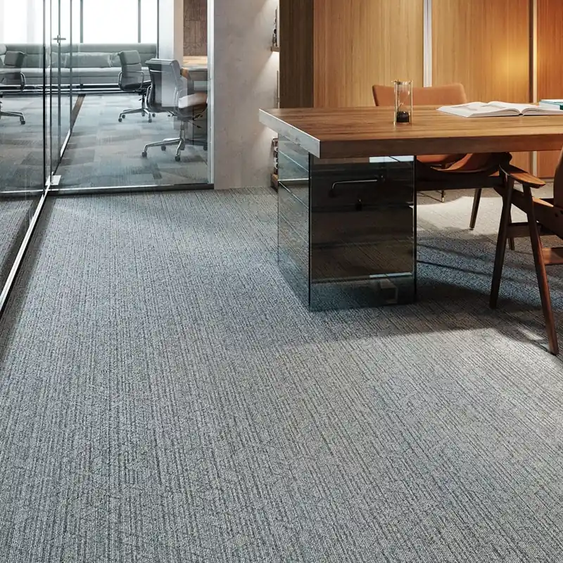 Grey office carpet with linear texture.