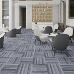 Modern office lounge area with grey checkered carpet tiles