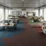 Modern open-plan office interior with multi-colored loop pile carpet tiles