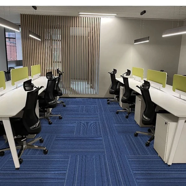 Modern workspace featuring vibrant blue carpet tiles