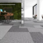 Multi-tone gray carpet tiles in modern workstation