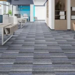 Open office corridor with blue striped grey carpet tiles
