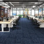 Spacious corporate office room with navy blue striped carpet tiles