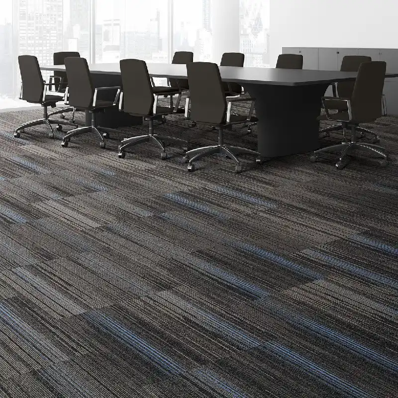 Striped carpet tiles in gray, black, and blue