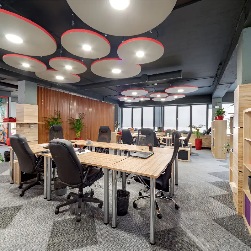 carpet tiles with subtle linear detailing installed in a contemporary open-plan office.