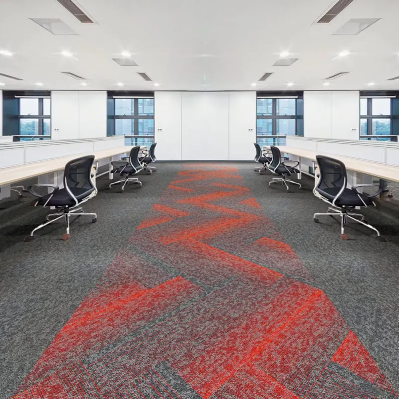 commercial carpet tiles featuring a bold red and gray linear chevron pattern