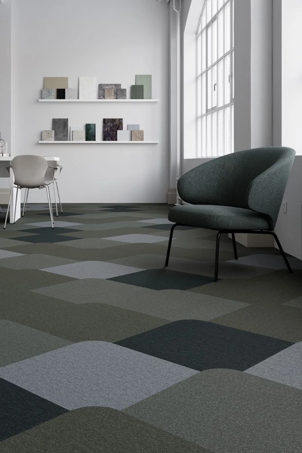 rounded geometric pattern office carpet tiles installed in a modern workspace showroom.
